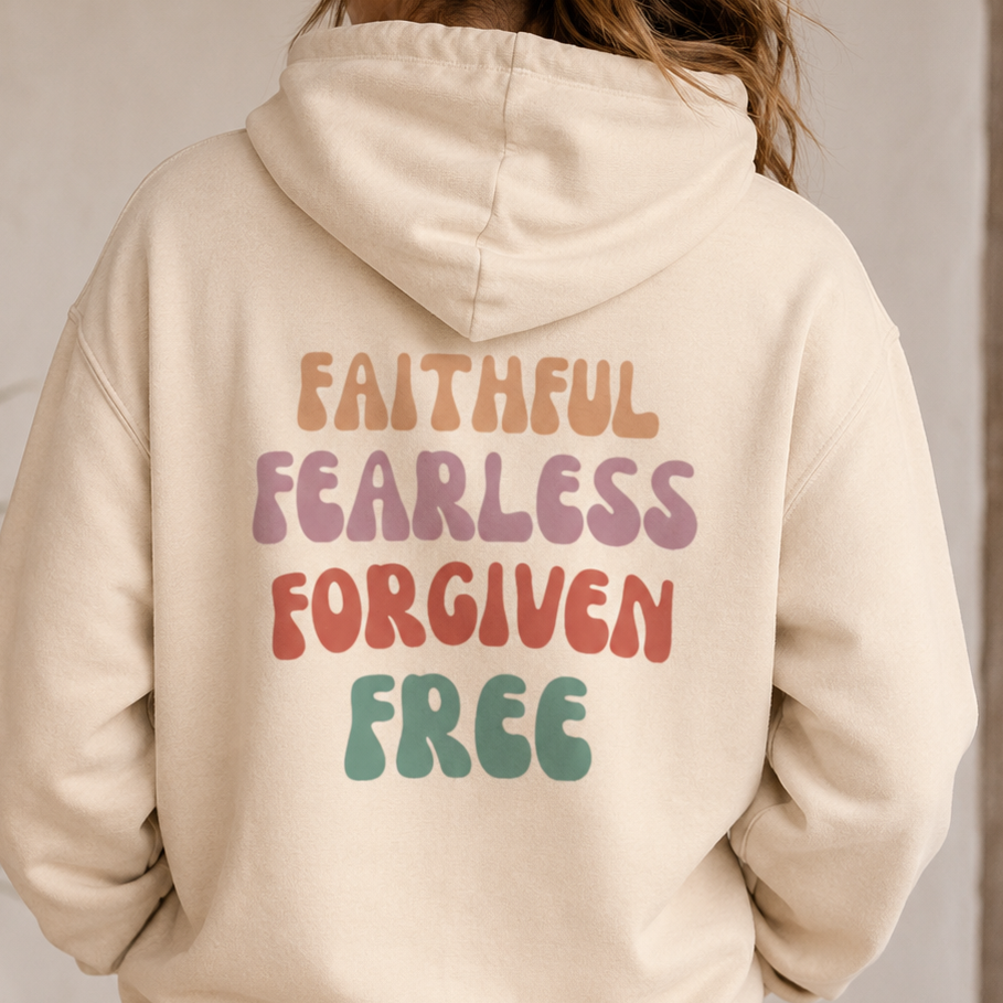 Person wearing a beige hoodie with motivational text on the back, standing against a neutral background.